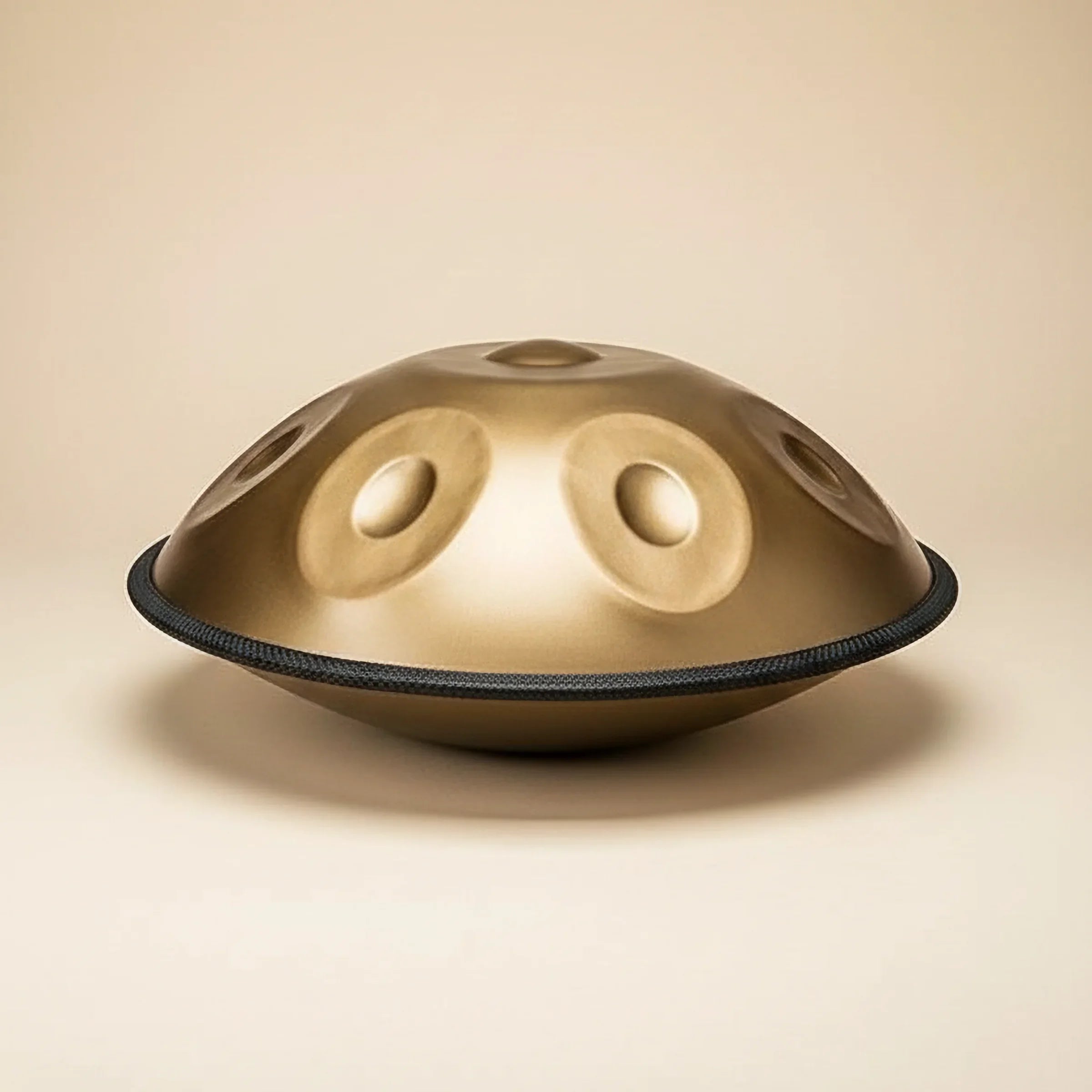 Handpan drum on a beige background