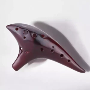 Goldesi red ceramic ocarina top view detail showing hole arrangement and glossy finish