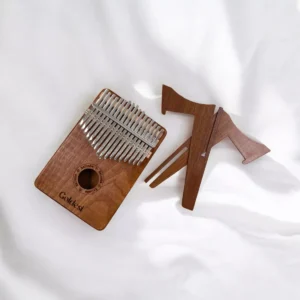 Mahogany kalimba and wooden stand pieces placed on a white background