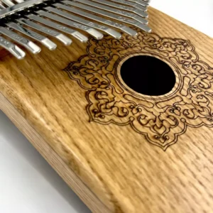 Goldesi natural wood kalimba close-up showing wood grain and craftsmanship detail
