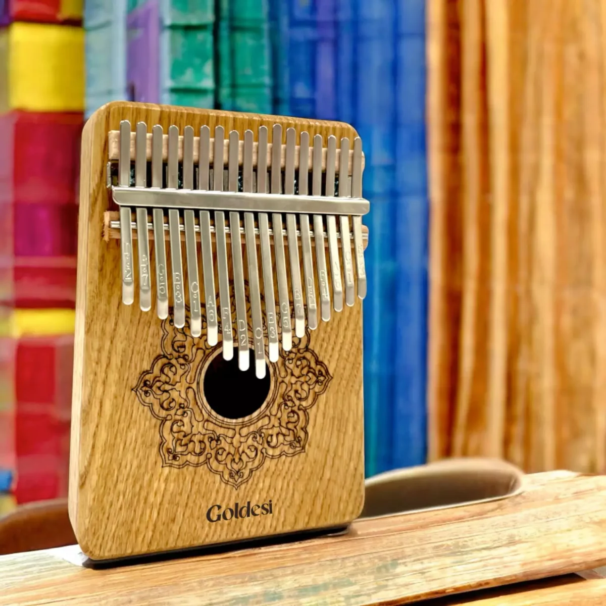 Goldesi natural wood kalimba angled view detail image showing key and wood craftsmanship