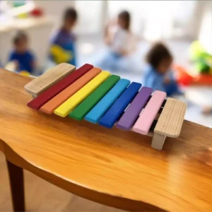 Colorful Goldesi xylophone in a preschool setting with children playing in the background